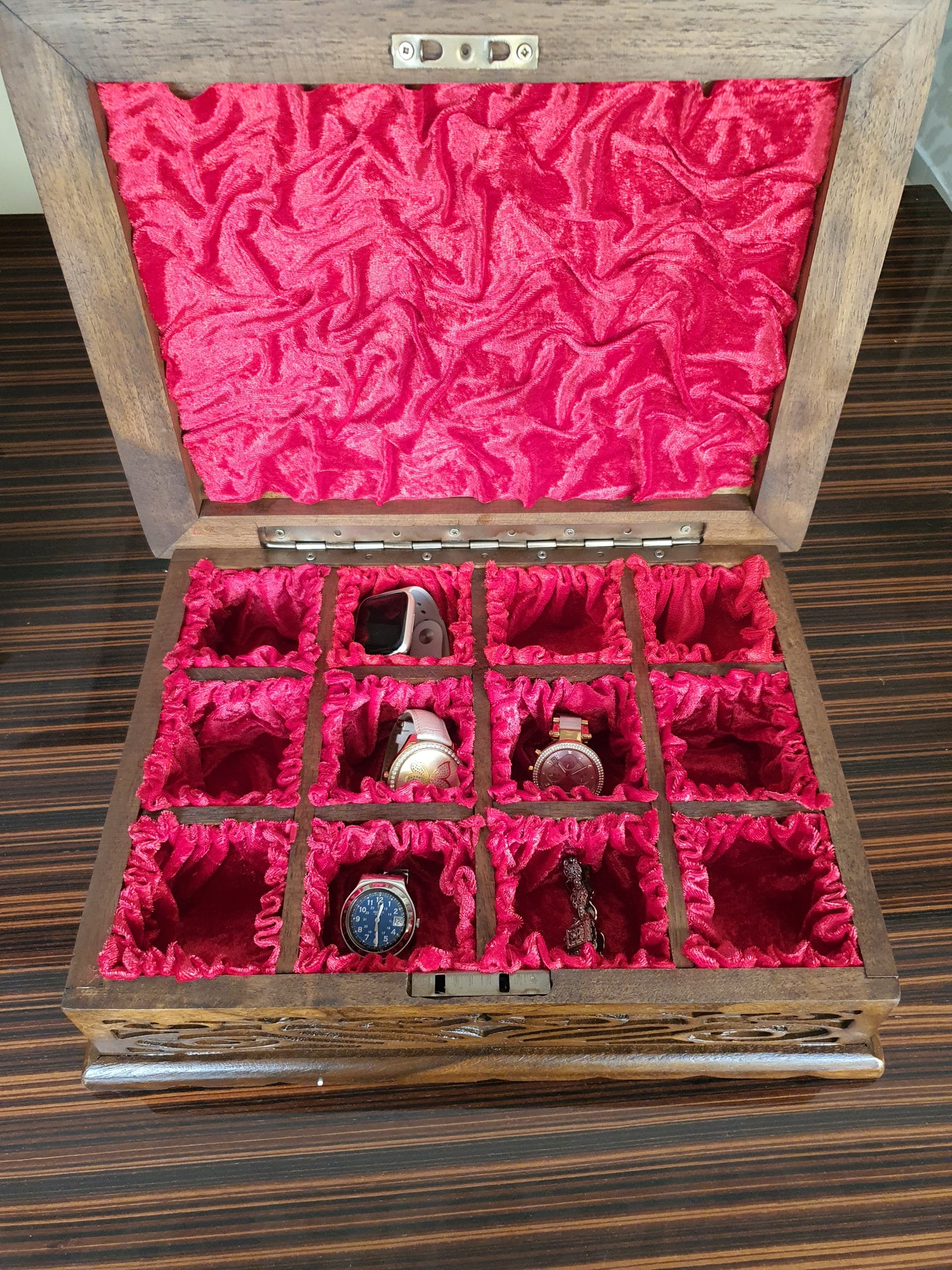 Wooden watch box with drawers and intricate hand-carved designs