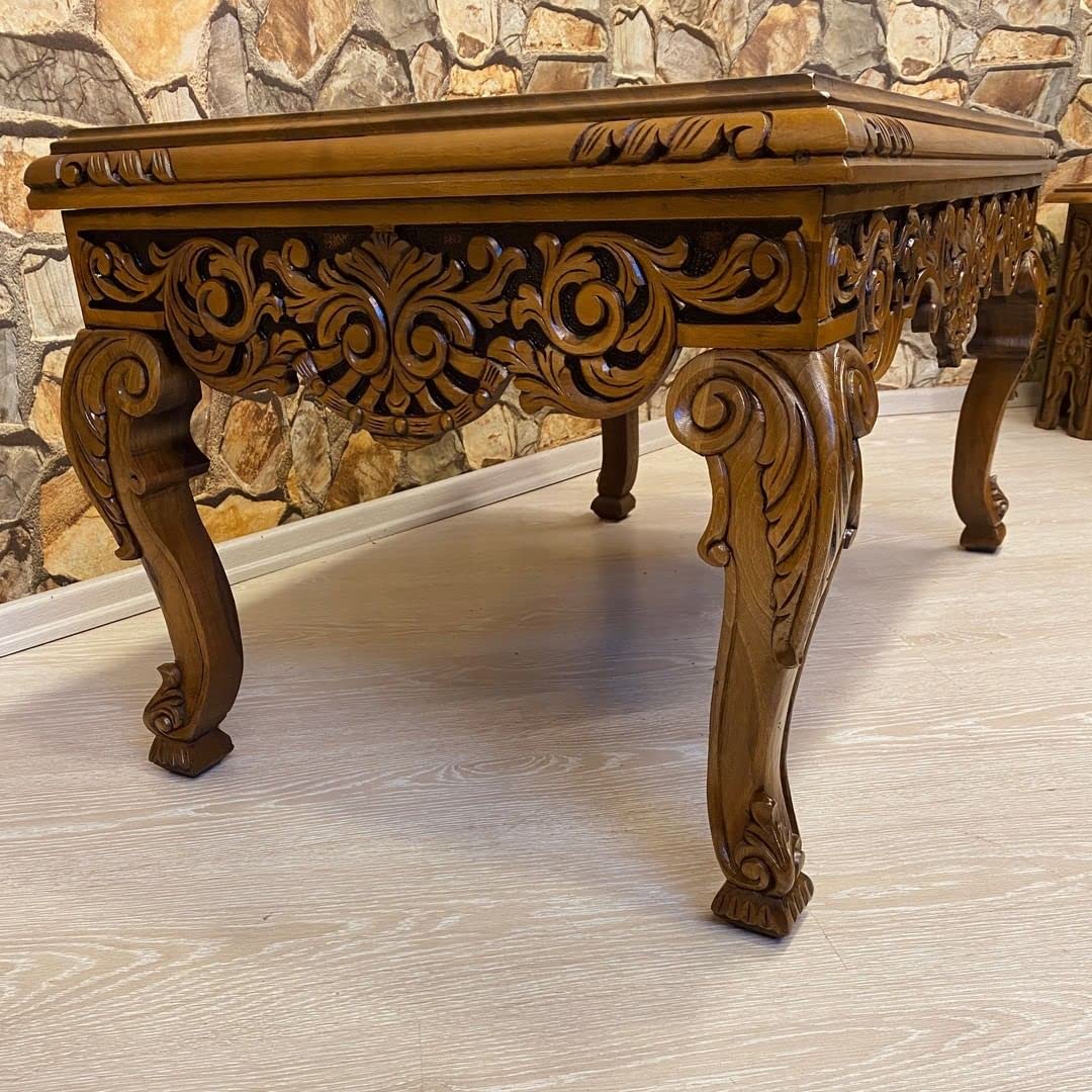 Detailed carving on coffee table surface