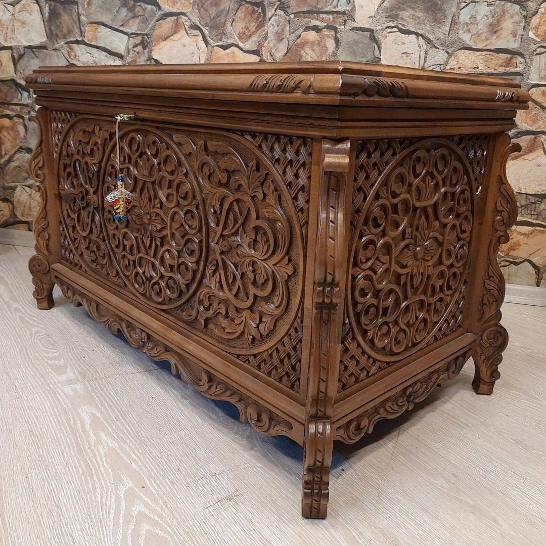 Detailed carving on walnut wood chest