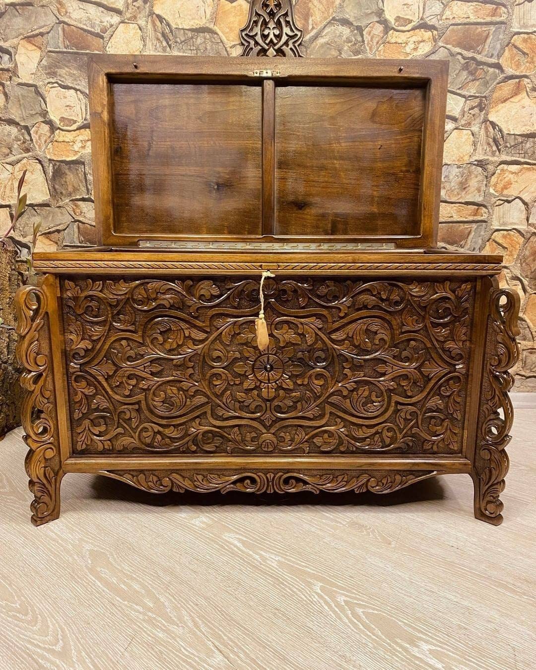 Detailed carving on walnut wood chest