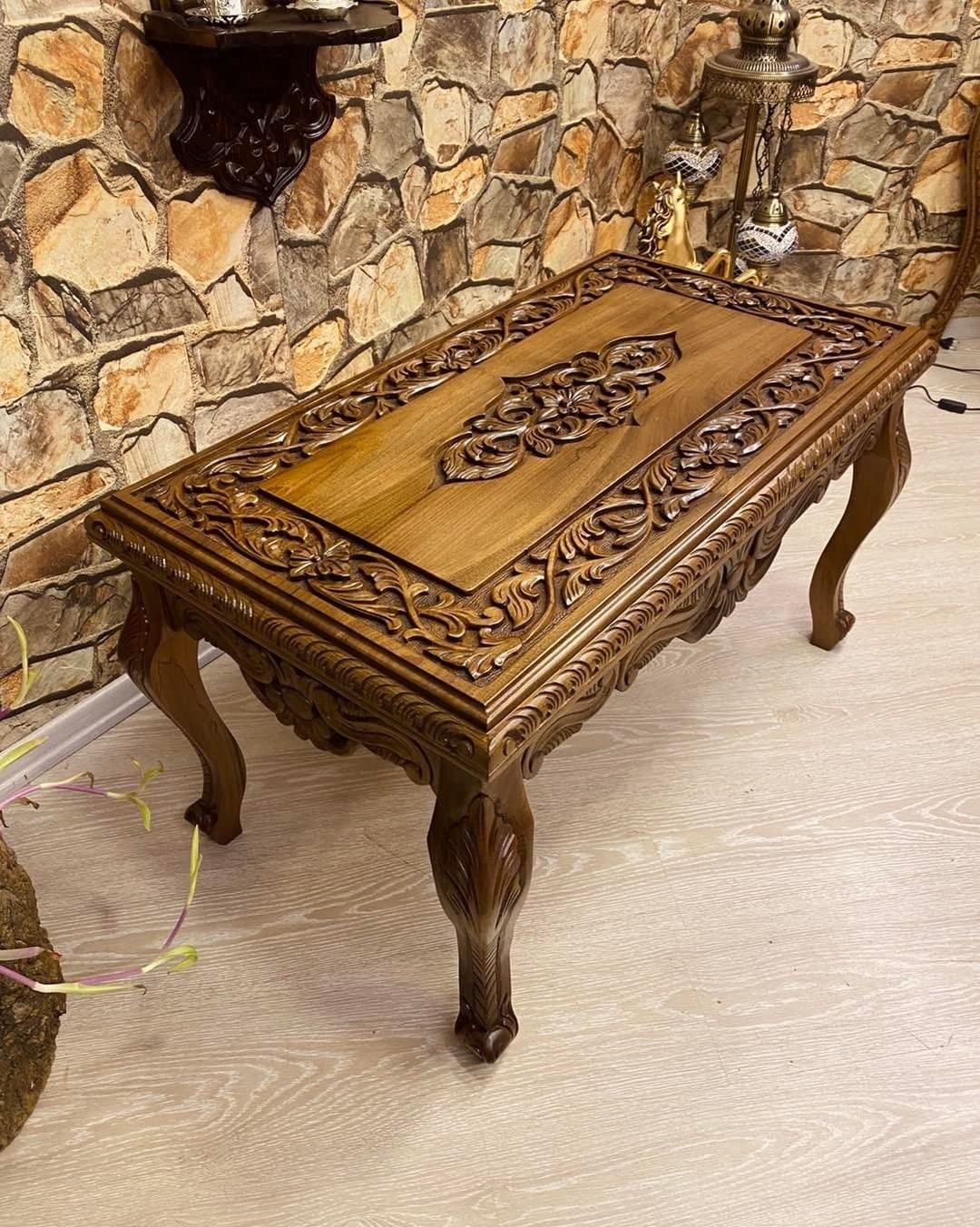 Detailed carving on walnut wood table