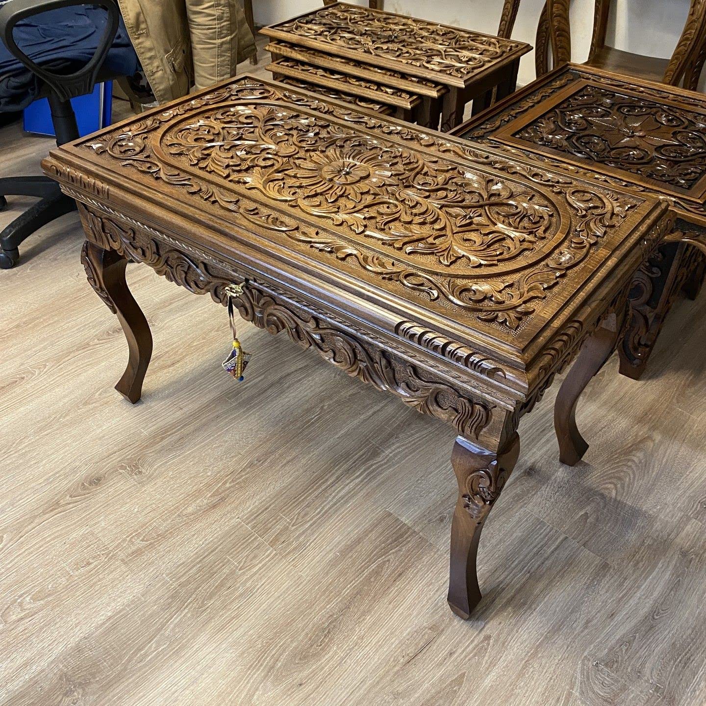 Detailed carving on walnut wood table