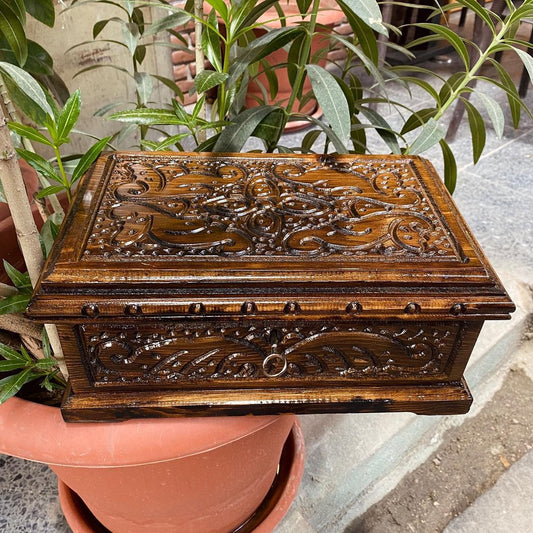 Carved wooden locking puzzle keepsake box with intricate designs