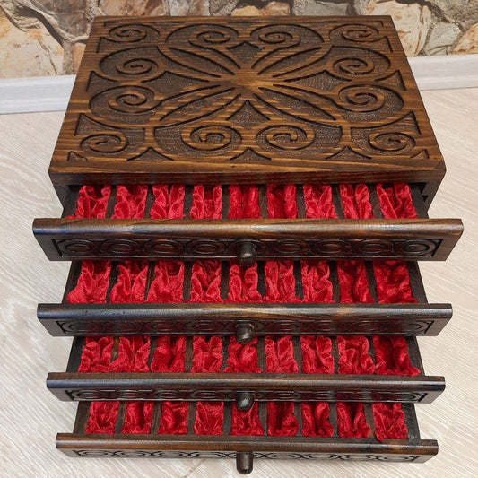 Wooden jewelry box with drawers and intricate hand-carved designs